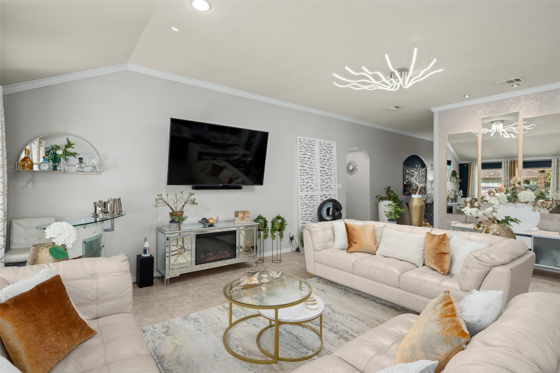 355 Evening Star Kyle, TX 78640 - Photo 4 of 21 Living room featuring crown molding.