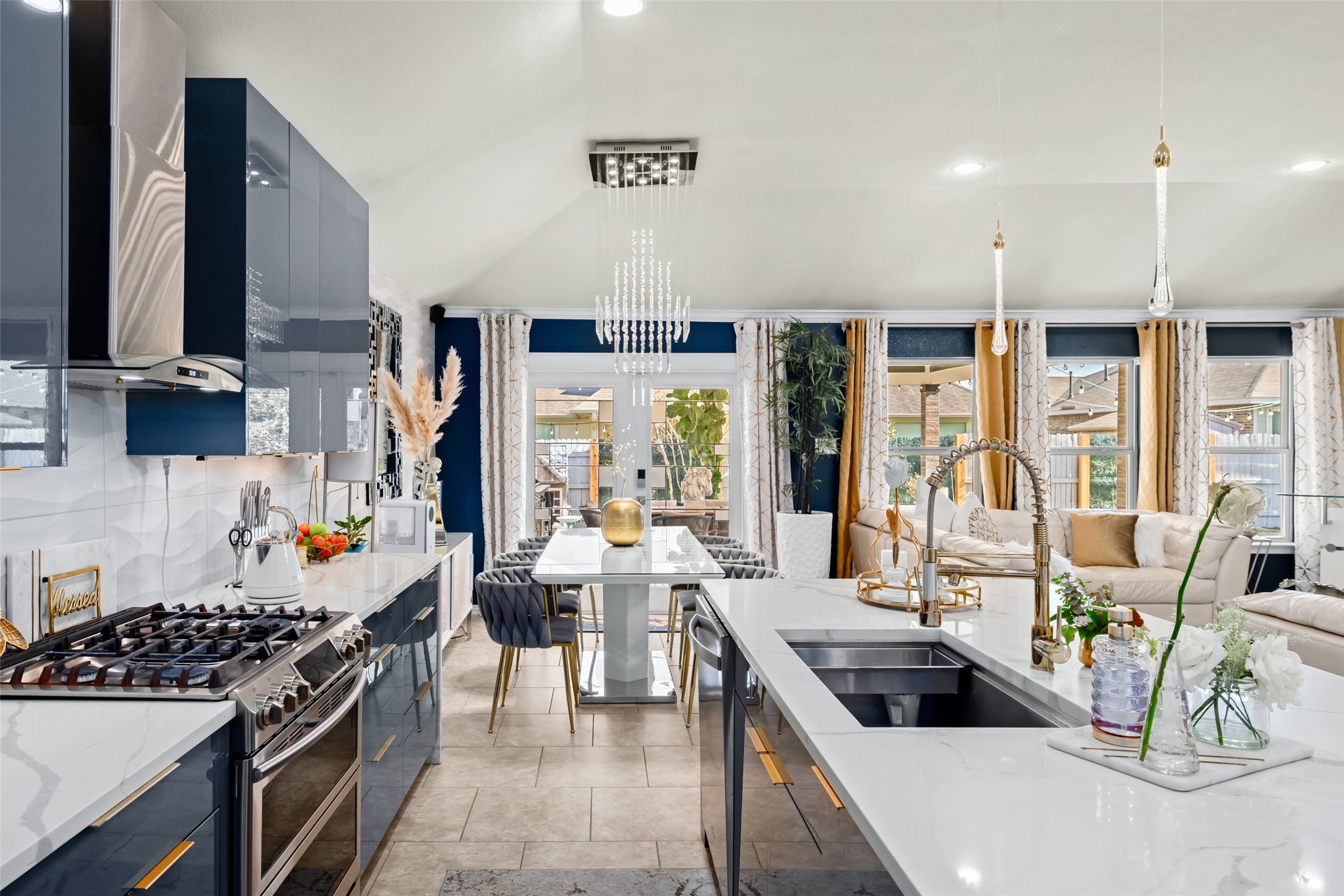 355 Evening Star Kyle, TX 78640 - Photo 7 of 21 a kitchen with stainless steel appliances a stove a sink a refrigerator and couches