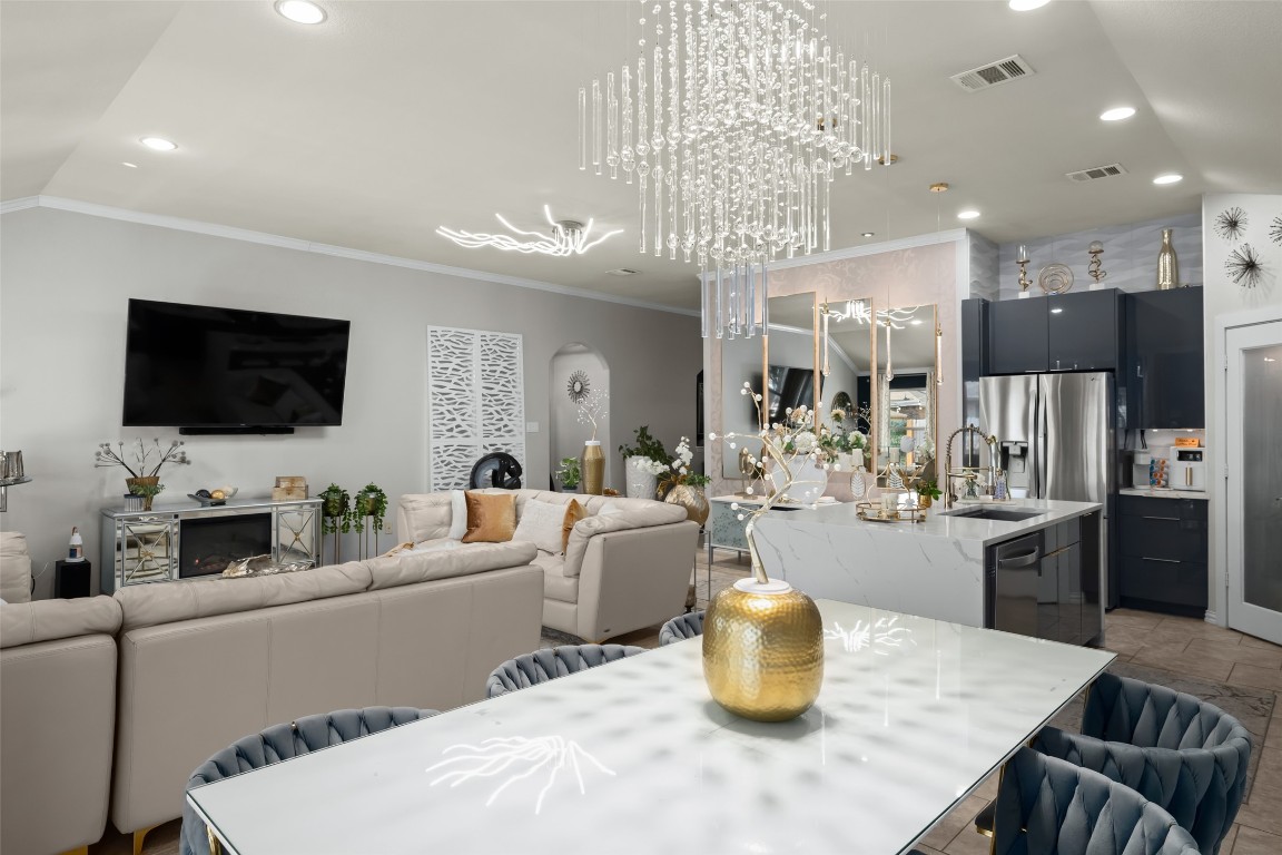 355 Evening Star Kyle, TX 78640 - Photo 10 of 21 Dining area with recessed lighting, a chandelier, and ornamental molding.