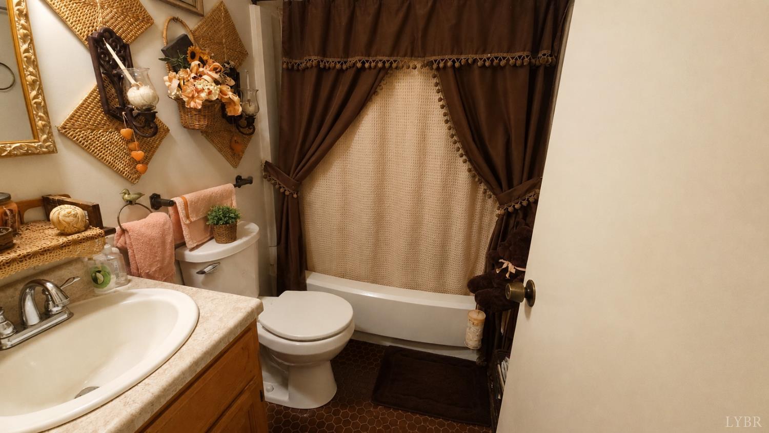 2346 Mitchell Mill Road Gladys, VA 24554 - Photo 13 of 38 a bathroom with a granite countertop sink toilet and shower