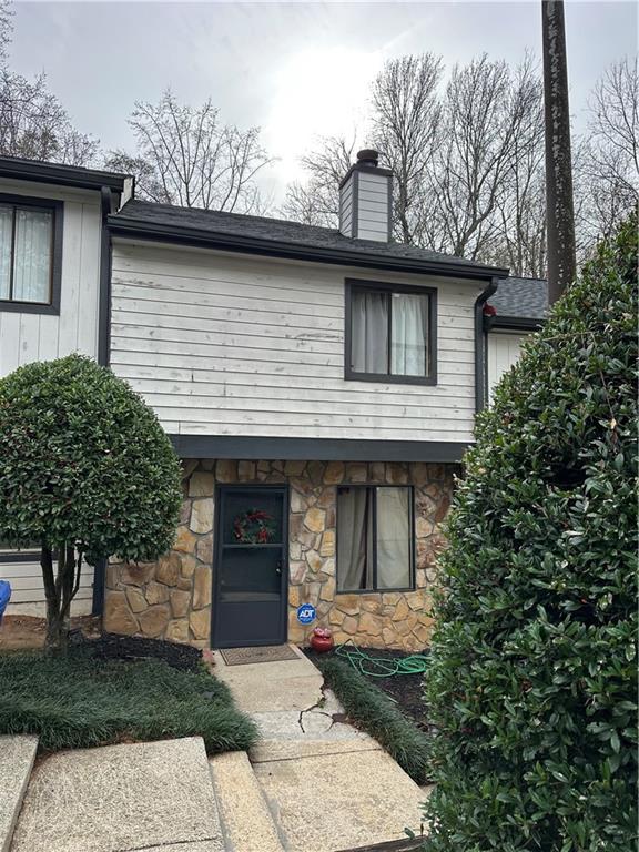 3655 Cobble Mill Lane Clarkston, GA 30021 - Photo 1 of 1 a front view of a house with garden