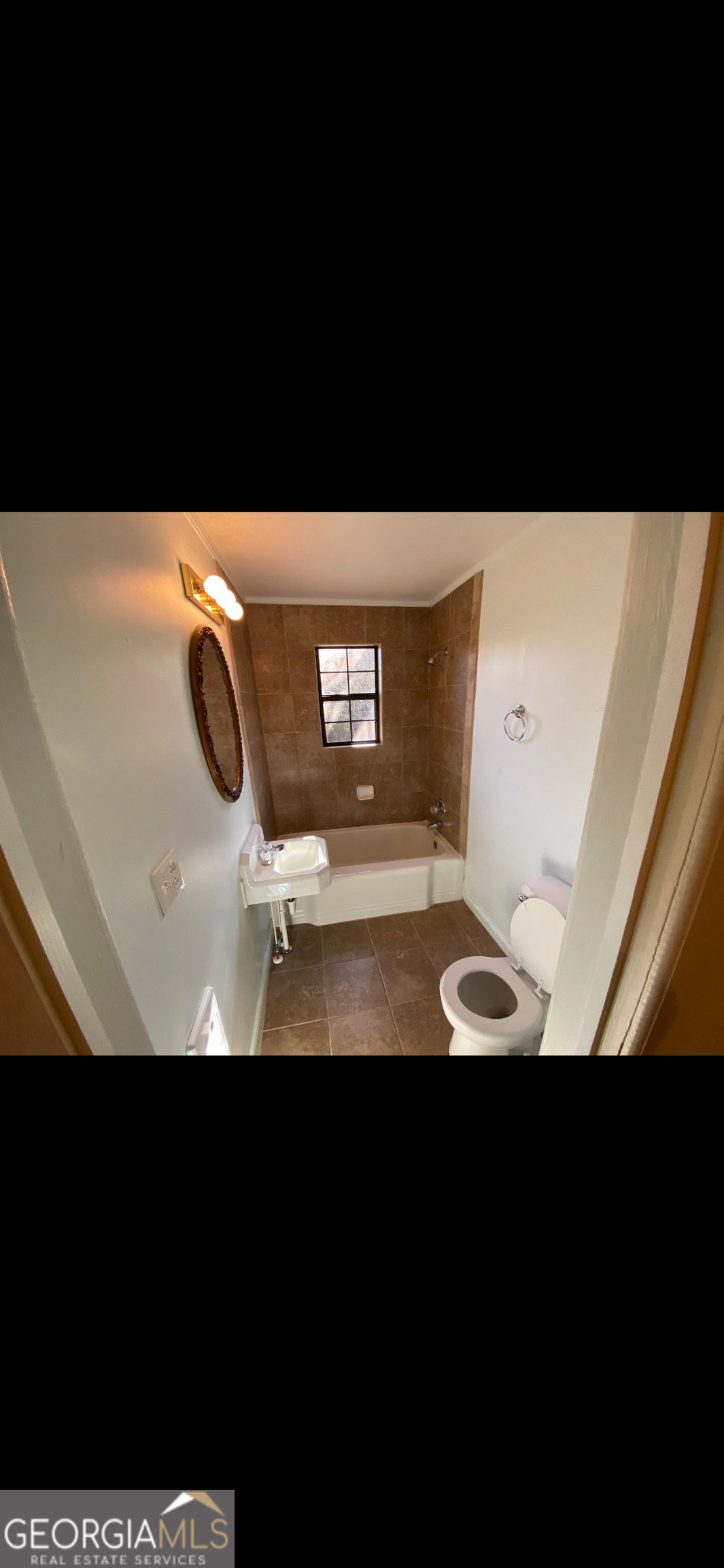 342 East Allen Street Baxley, GA 31513 - Photo 7 of 9 a view of a living room with a projector