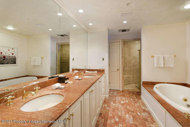 825 Ute Avenue, Unit A Aspen, CO 81611 - Photo 14 of 23 a spacious bathroom with a granite countertop tub sink and mirror