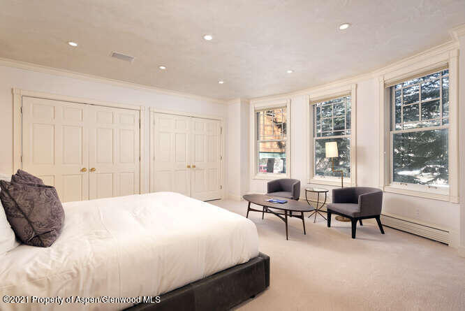 825 Ute Avenue, Unit A Aspen, CO 81611 - Photo 15 of 23 a bedroom with a bed and a window