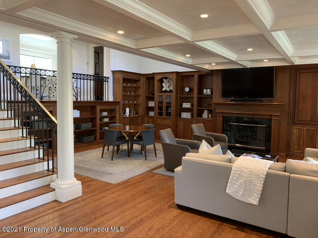 825 Ute Avenue, Unit A Aspen, CO 81611 - Photo 2 of 23 a living room with furniture a flat screen tv and a fireplace