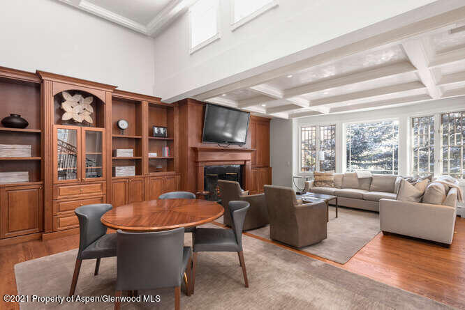 825 Ute Avenue, Unit A Aspen, CO 81611 - Photo 6 of 23 a living room with fireplace furniture and a large window
