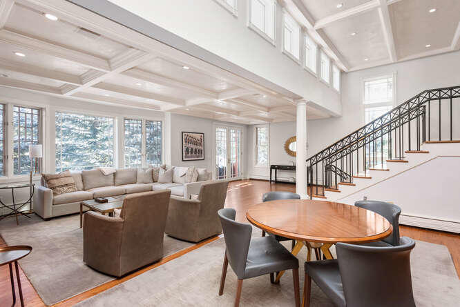 825 Ute Avenue, Unit A Aspen, CO 81611 - Photo 7 of 23 a living room with furniture a table and a large window