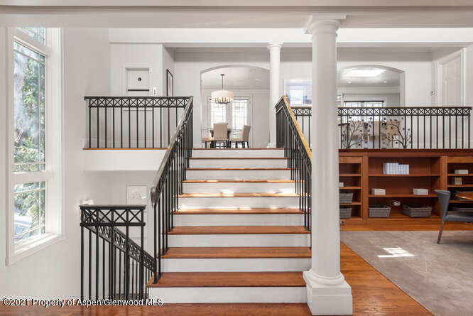 825 Ute Avenue, Unit A Aspen, CO 81611 - Photo 8 of 23 a view of staircase with white walls and windows