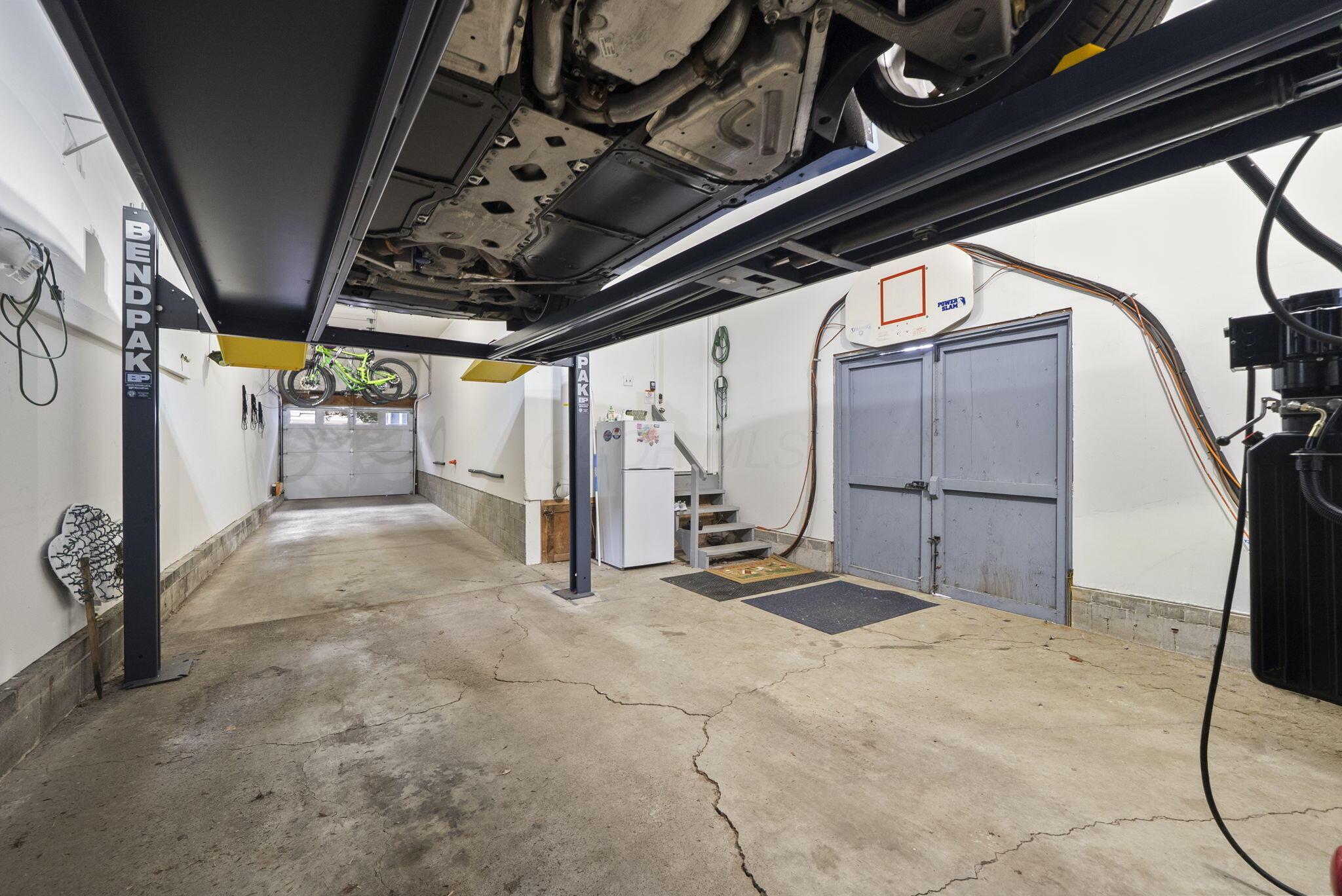 1851 Berkshire Road Columbus, OH 43221 - Photo 71 of 125 View from under the lift, tall enough to park an additioanl vehicle.