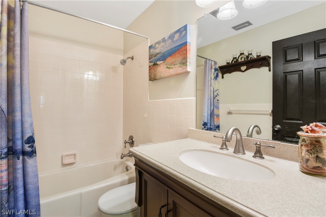 12478 Dolphin Road Bokeelia, FL 33922 - Photo 20 of 25 a bathroom with a sink and a mirror
