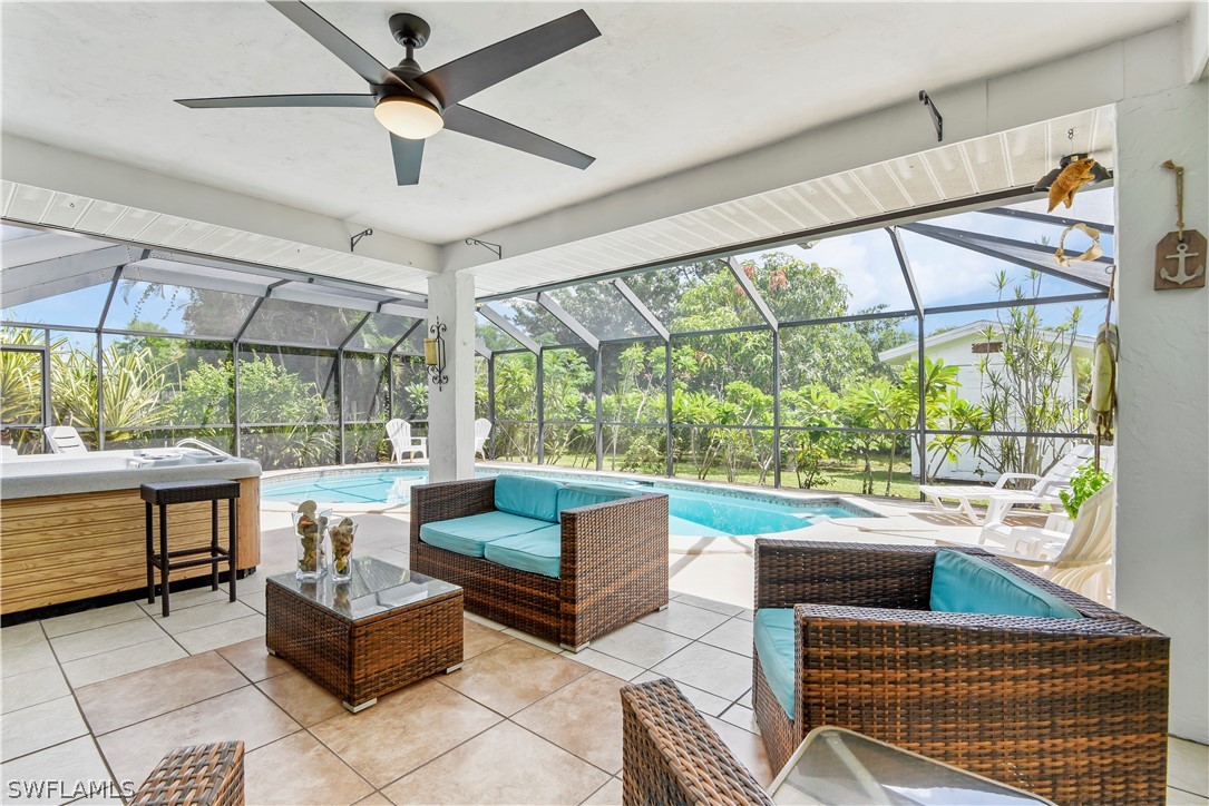 12478 Dolphin Road Bokeelia, FL 33922 - Photo 2 of 25 a living room with couch a large window with outer view