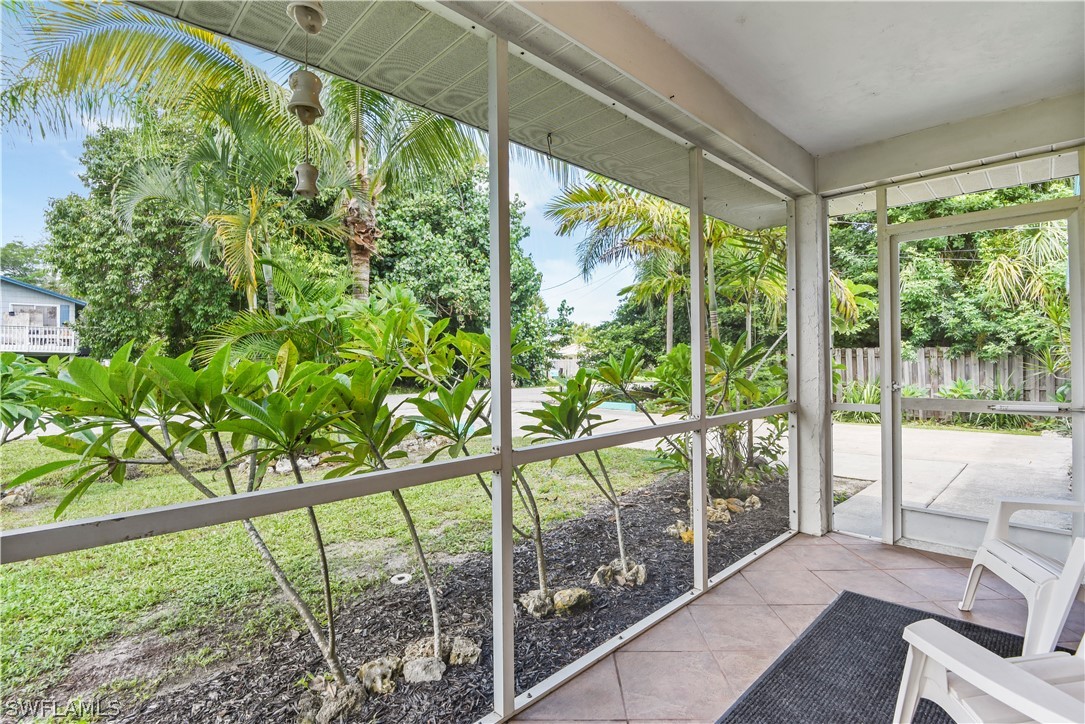 12478 Dolphin Road Bokeelia, FL 33922 - Photo 23 of 25 a view of a porch and garden