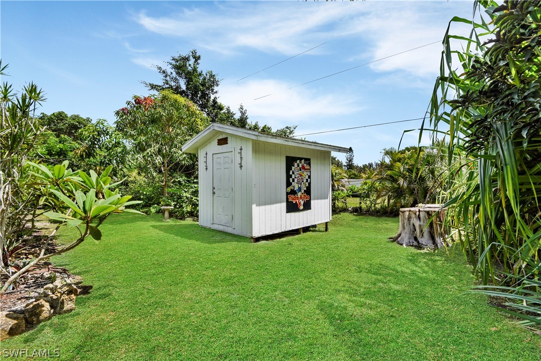 12478 Dolphin Road Bokeelia, FL 33922 - Photo 5 of 25 a view of a house with backyard