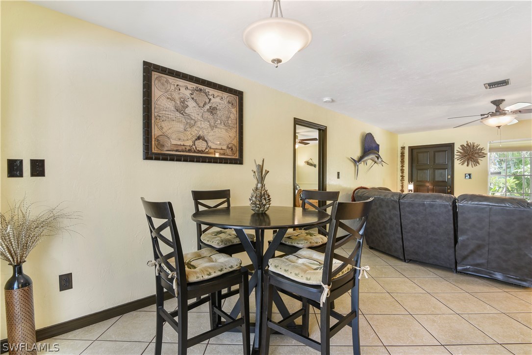 12478 Dolphin Road Bokeelia, FL 33922 - Photo 8 of 25 a dining room with furniture and window