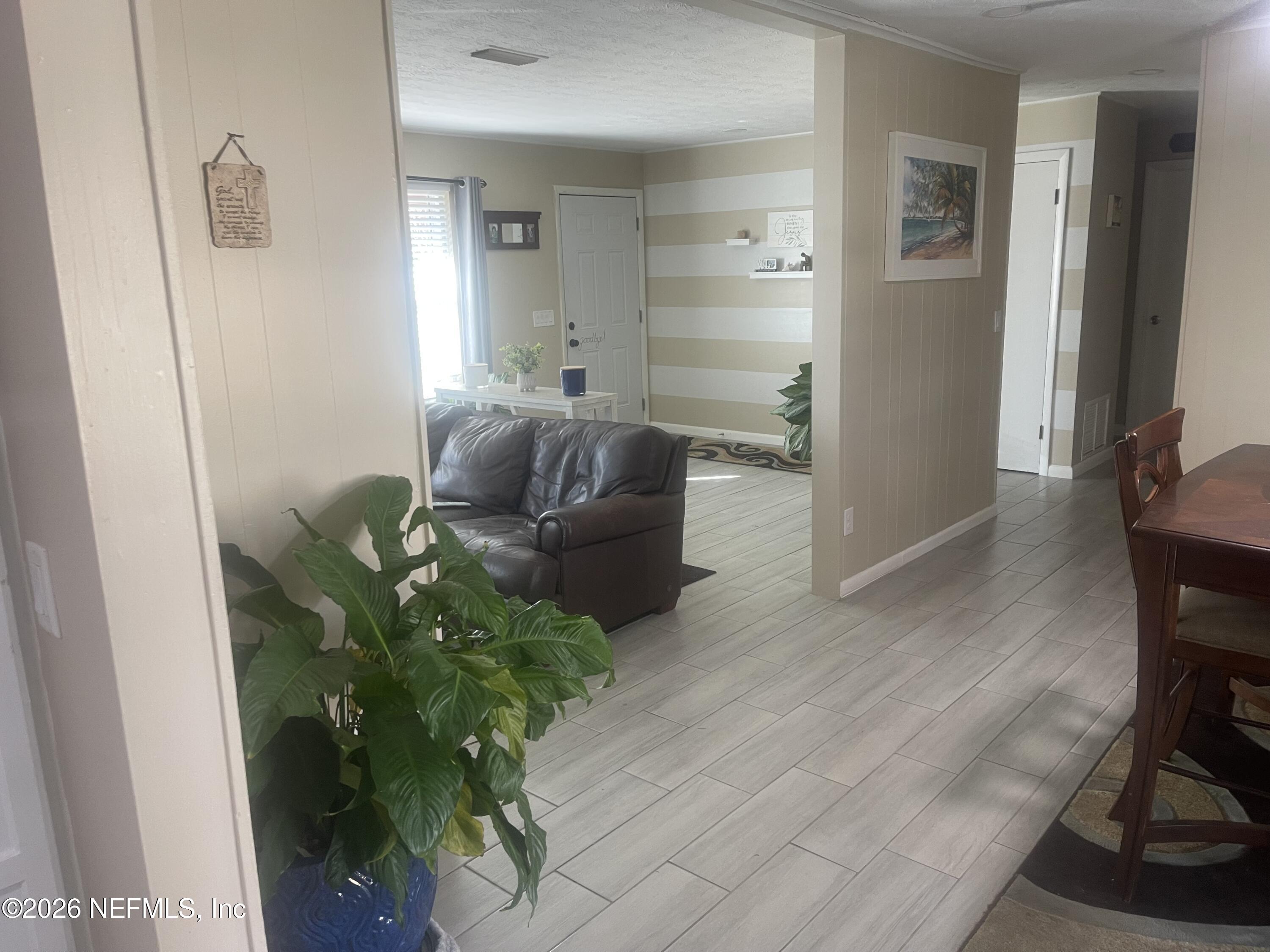 5203 Clarendon Road Jacksonville, FL 32205 - Photo 13 of 14 a living room with furniture and a potted plant