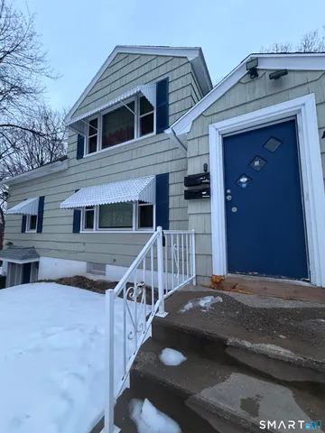 a view of a house with wooden stairs