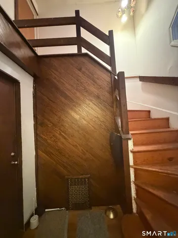 a view of a room with an empty space and a window