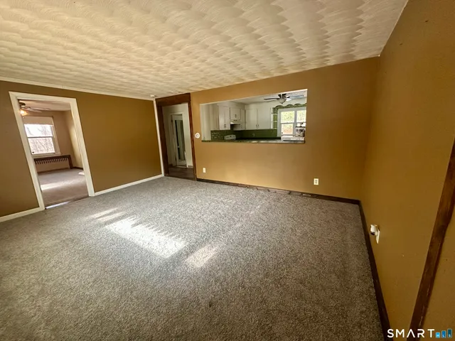 a view of a living room with a large window