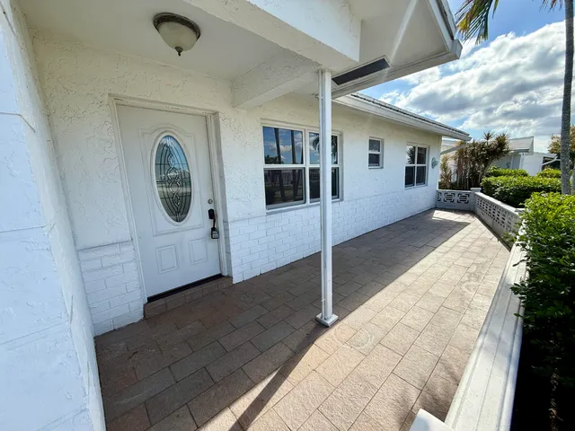 a view of a porch with seating space