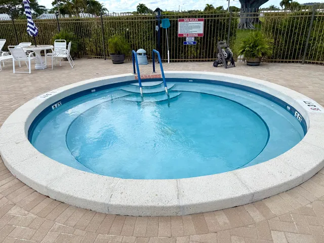 a view of a swimming pool with a sitting space