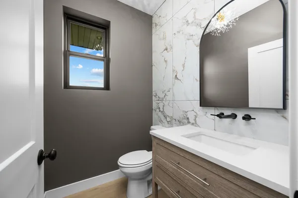 a view of an entryway with wooden floor