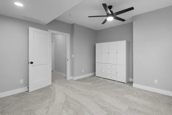 a bathroom with a sink a toilet and vanity