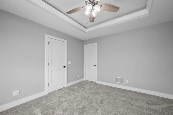 an empty room with a empty space and windows
