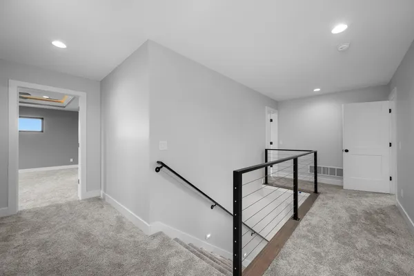 a view of empty room with wooden ceiling