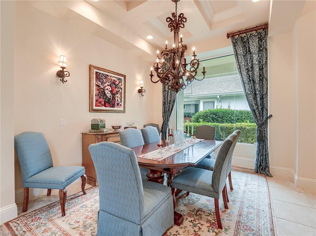 10128 Idle Pine Lane Estero, FL 34135 - Photo 13 of 50 a view of a dining room with furniture window and wooden floor