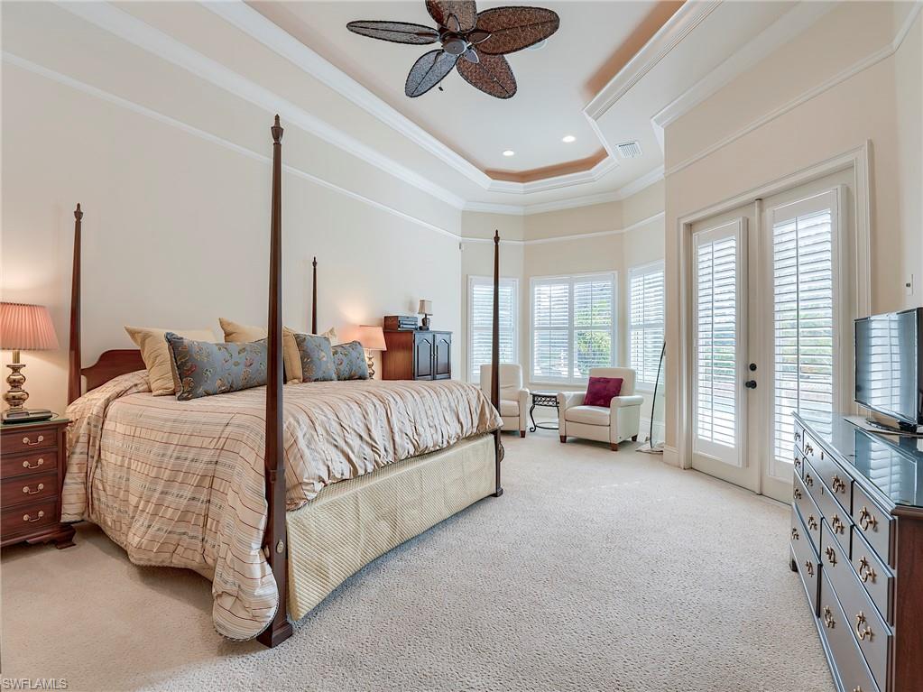 10128 Idle Pine Lane Estero, FL 34135 - Photo 16 of 50 a bedroom with bed and a large window