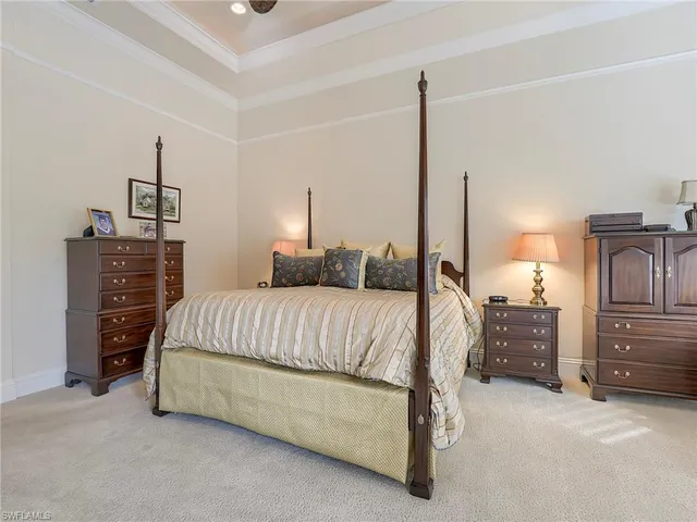 a bedroom with a bed and dresser