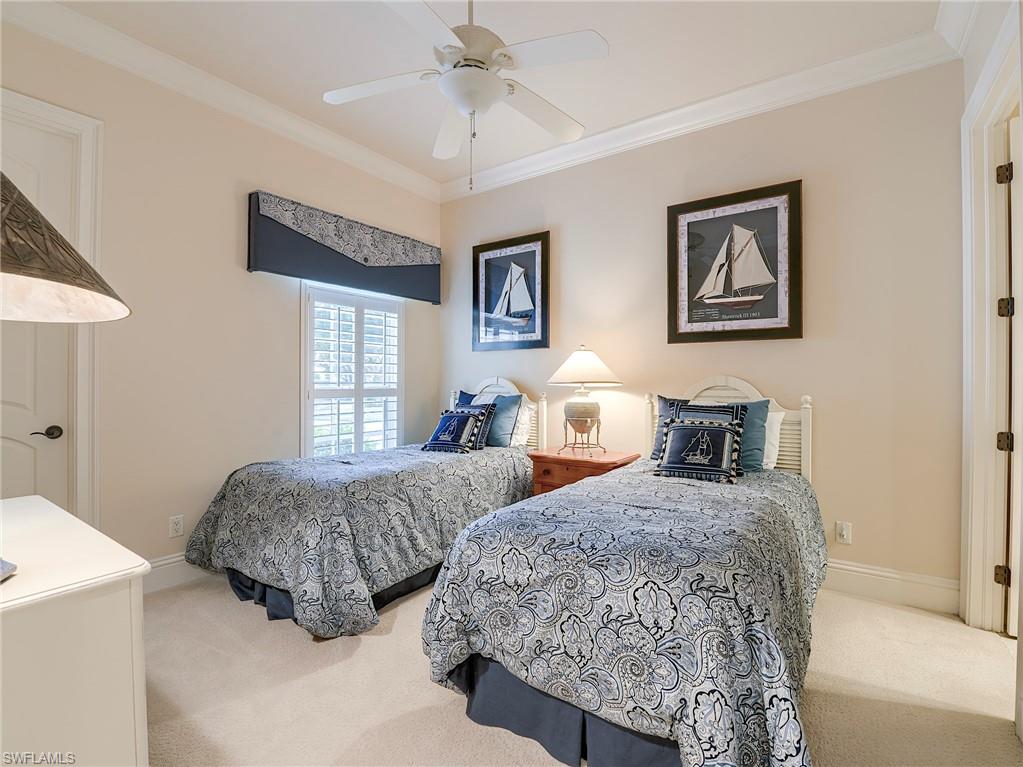 10128 Idle Pine Lane Estero, FL 34135 - Photo 21 of 50 a bedroom with two beds and painting on the wall