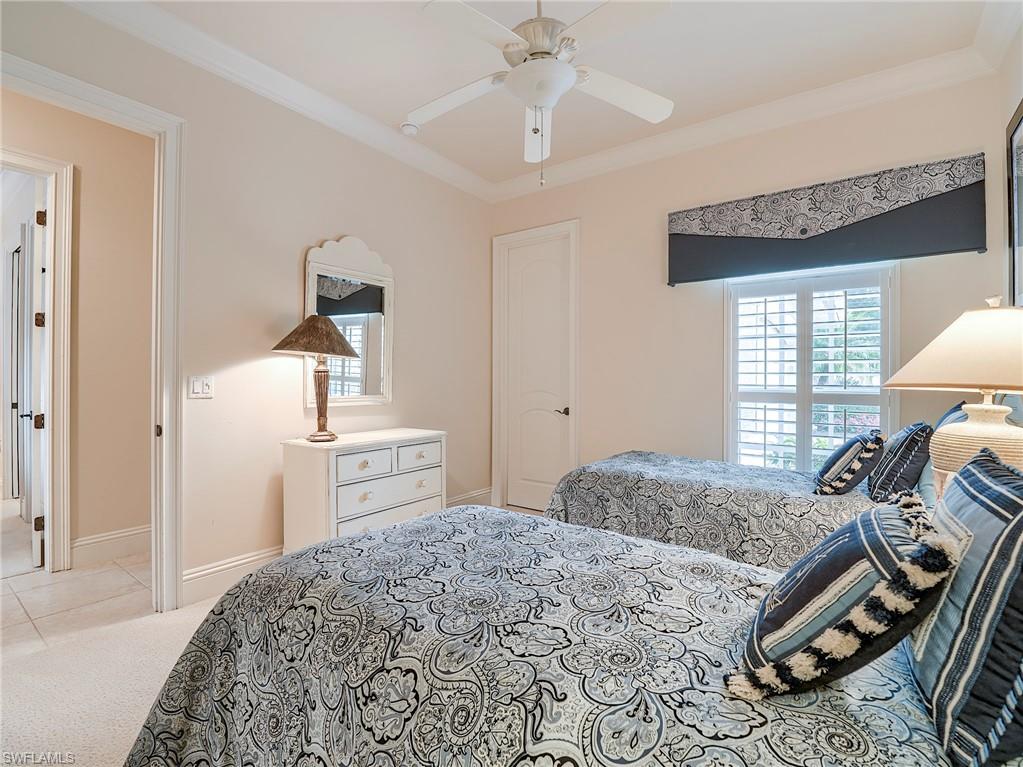 10128 Idle Pine Lane Estero, FL 34135 - Photo 22 of 50 a bedroom with a bed and a window