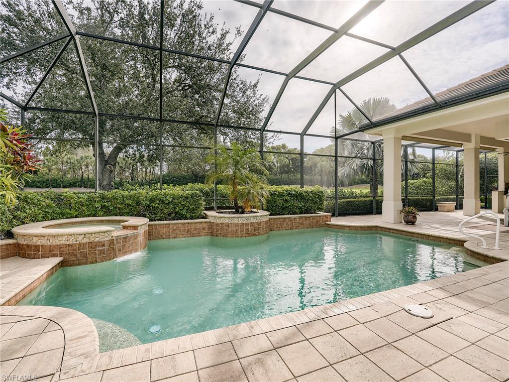 10128 Idle Pine Lane Estero, FL 34135 - Photo 27 of 50 a view of a swimming pool with a porch