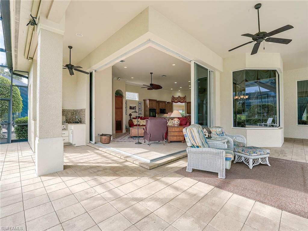 10128 Idle Pine Lane Estero, FL 34135 - Photo 33 of 50 a view of a livingroom with furniture and windows