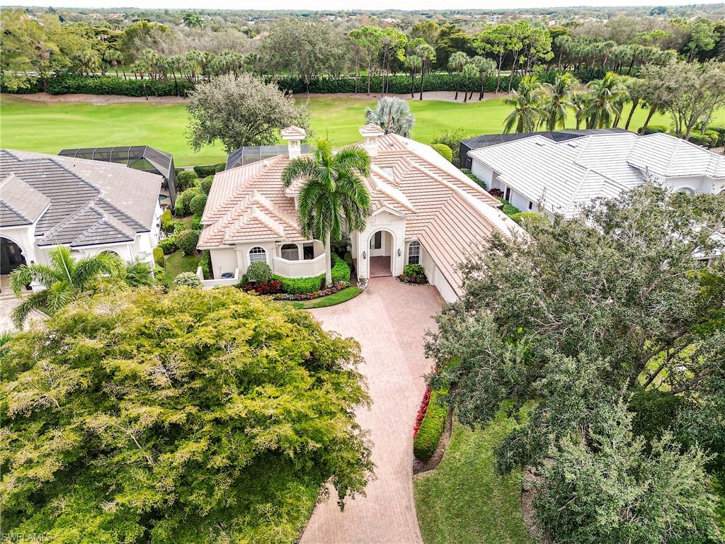 10128 Idle Pine Lane Estero, FL 34135 - Photo 36 of 50 an aerial view of house with yard and lake view