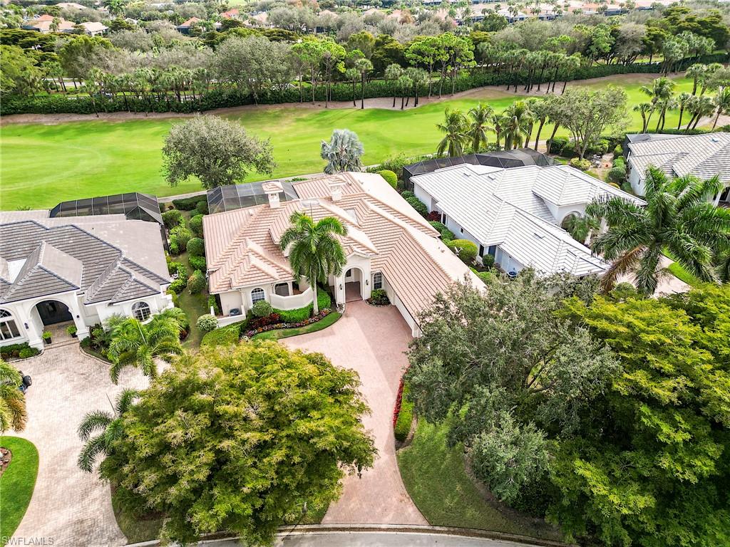 10128 Idle Pine Lane Estero, FL 34135 - Photo 39 of 50 an aerial view of a house with a garden and lake view