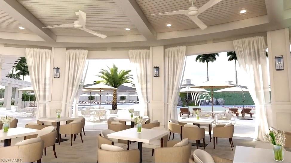 10128 Idle Pine Lane Estero, FL 34135 - Photo 43 of 50 a living room with furniture and large windows