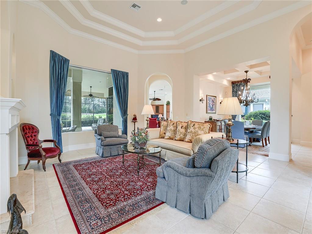 10128 Idle Pine Lane Estero, FL 34135 - Photo 10 of 50 a living room with furniture and a rug