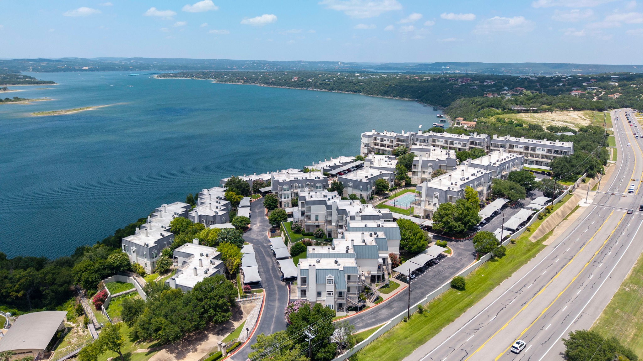 2918 Ranch Road 620 North, Unit S242 Austin, TX 78734 - Photo 31 of 35 Perched above the waterfront, this multi-unit complex offers commanding views and convenient highway access.