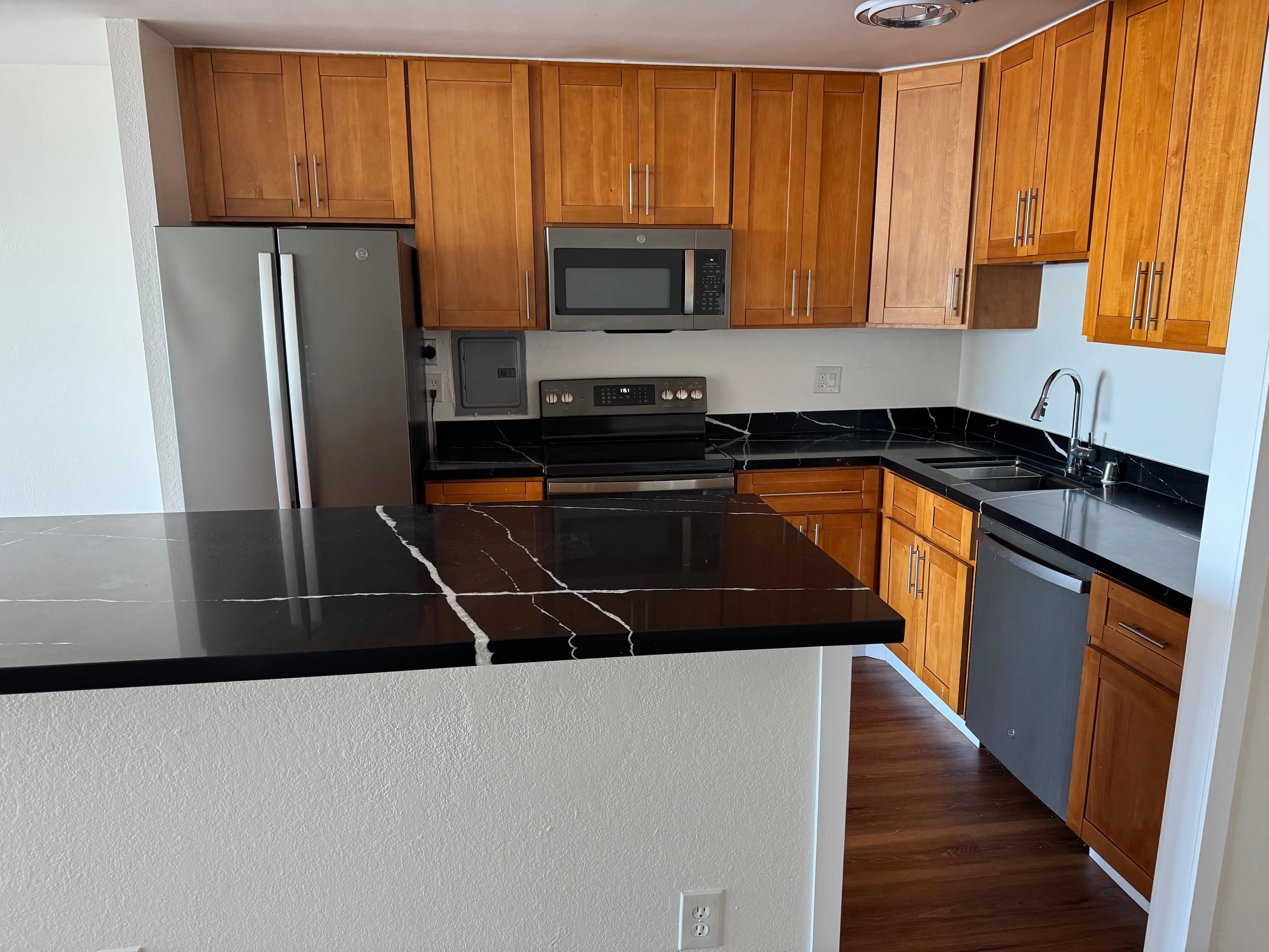 555 Pierce Street, Unit 735 Albany, CA 94706 - Photo 11 of 17 a kitchen with granite countertop a refrigerator stove and sink