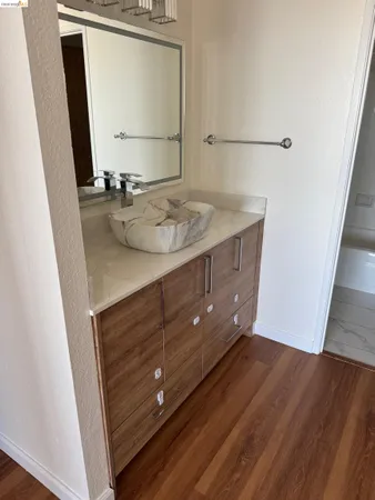 a bathroom with a sink and a mirror