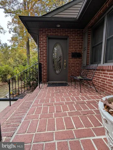 a brick building with a bench