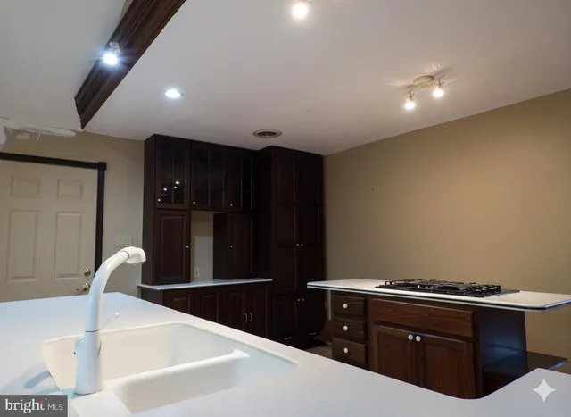 a bathroom with a bathtub sink and mirror