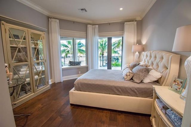 a spacious bathroom with a granite countertop sink a toilet a mirror and bathtub