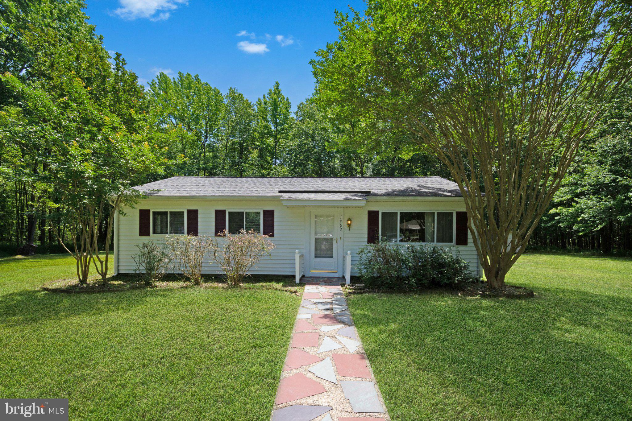 1469 Cedarhurst Road Shady Side, MD 20764 - Photo 1 of 19 a view of a house with a yard