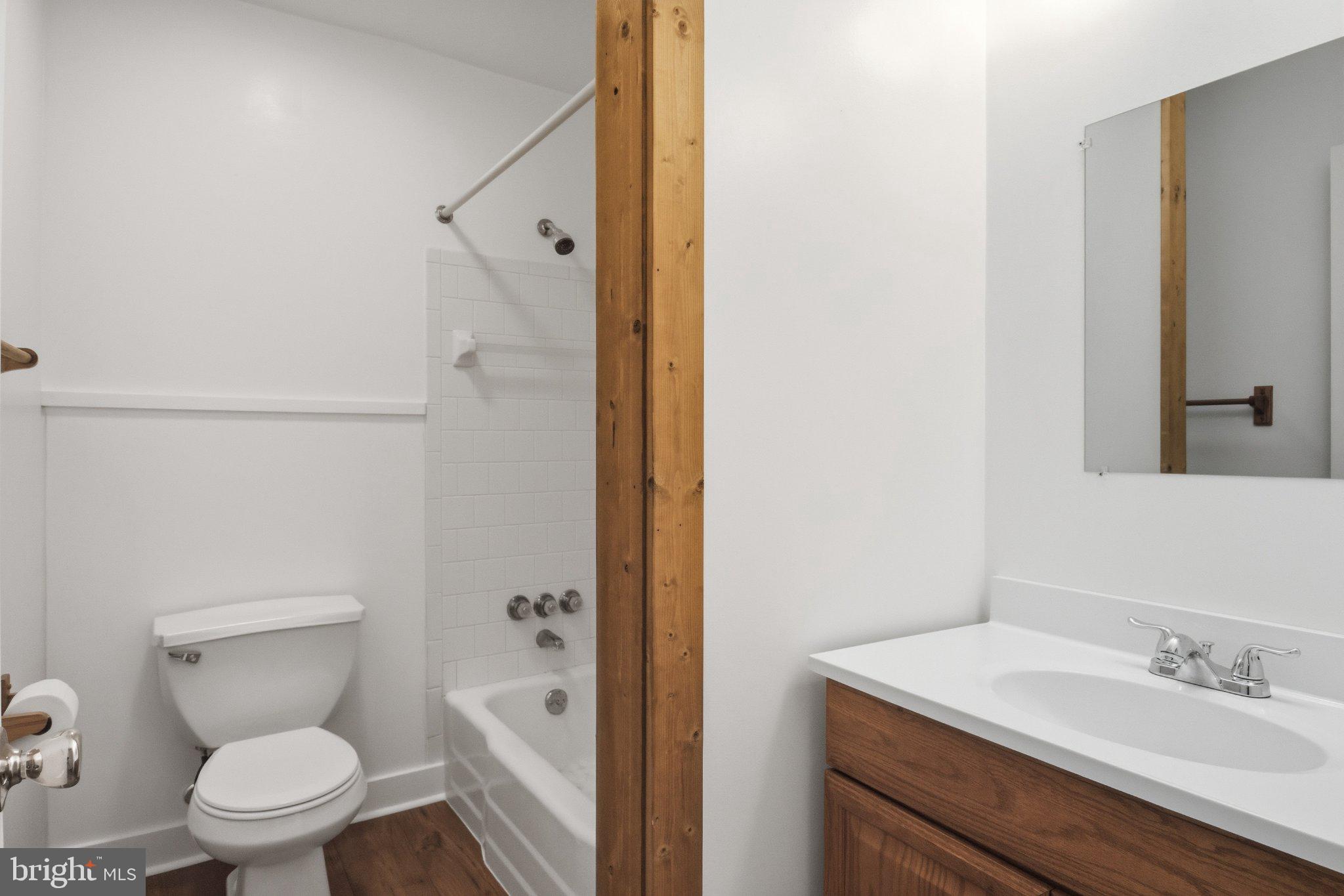 1469 Cedarhurst Road Shady Side, MD 20764 - Photo 11 of 19 a white toilet sitting next to a bathroom sink
