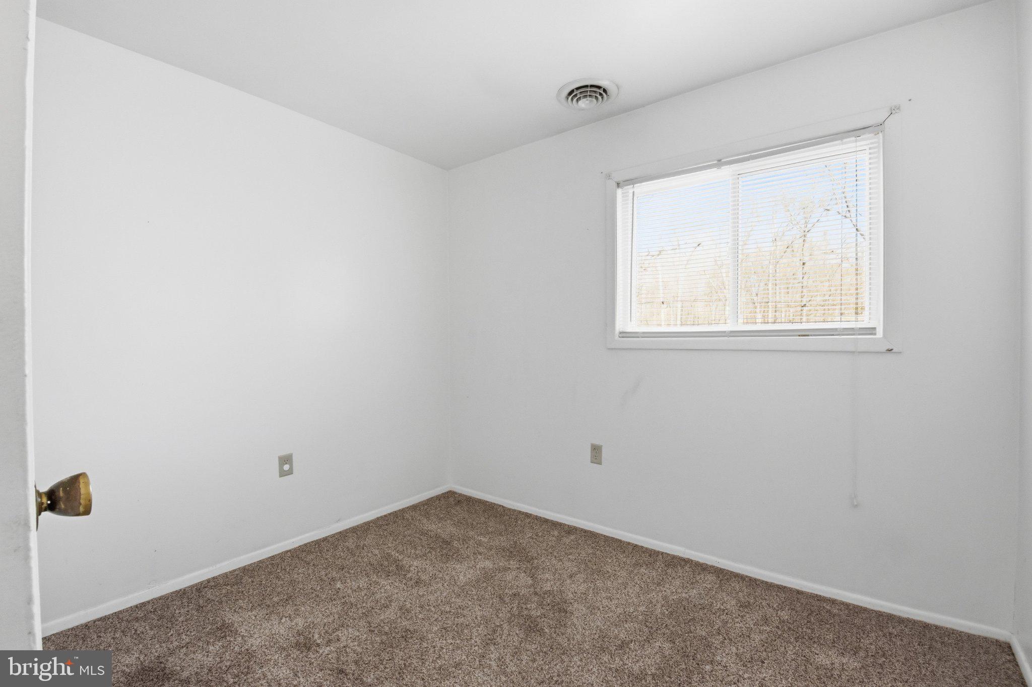 1469 Cedarhurst Road Shady Side, MD 20764 - Photo 15 of 19 an empty room with windows