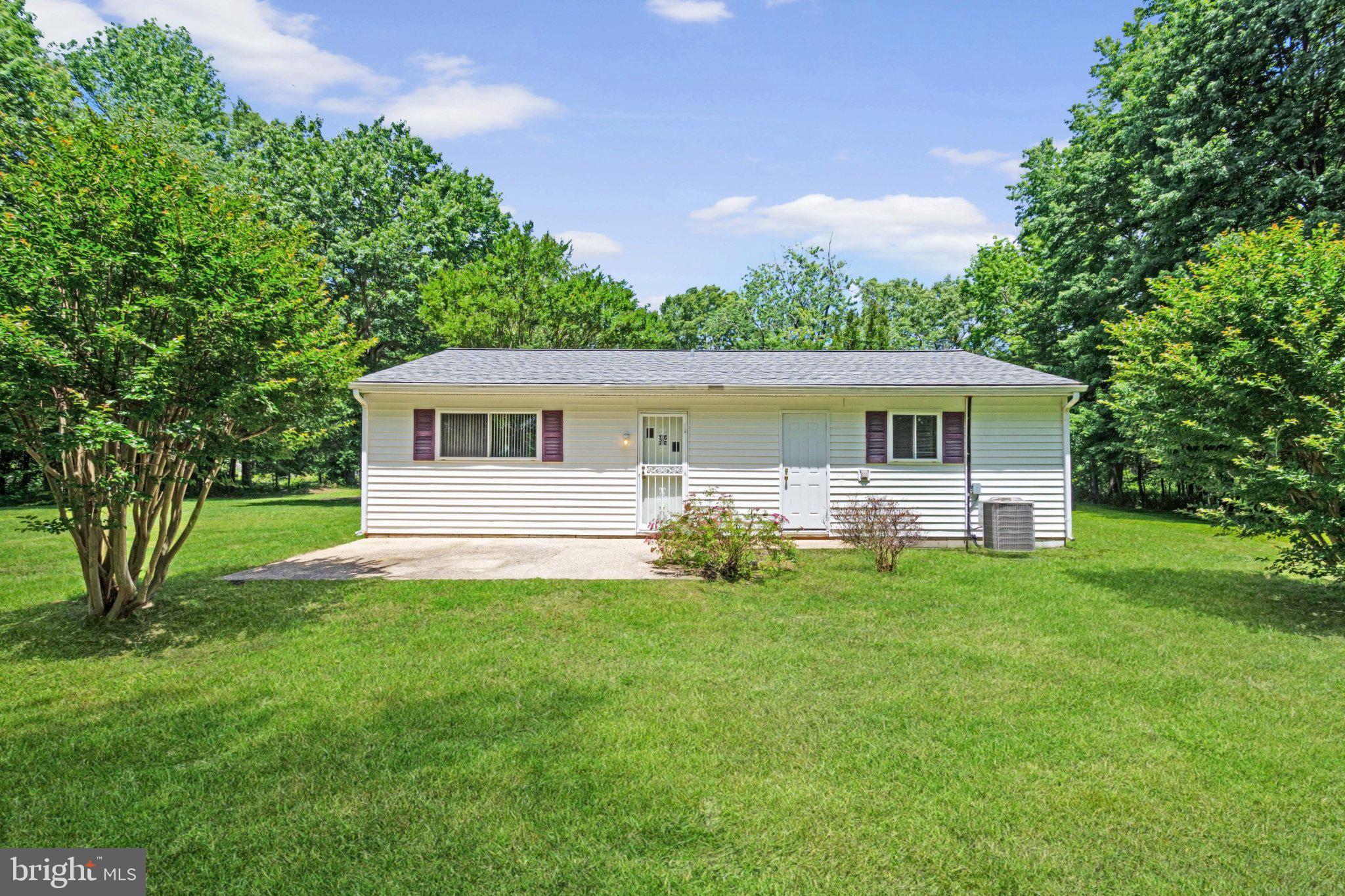 1469 Cedarhurst Road Shady Side, MD 20764 - Photo 17 of 19 a front view of house with yard and green space