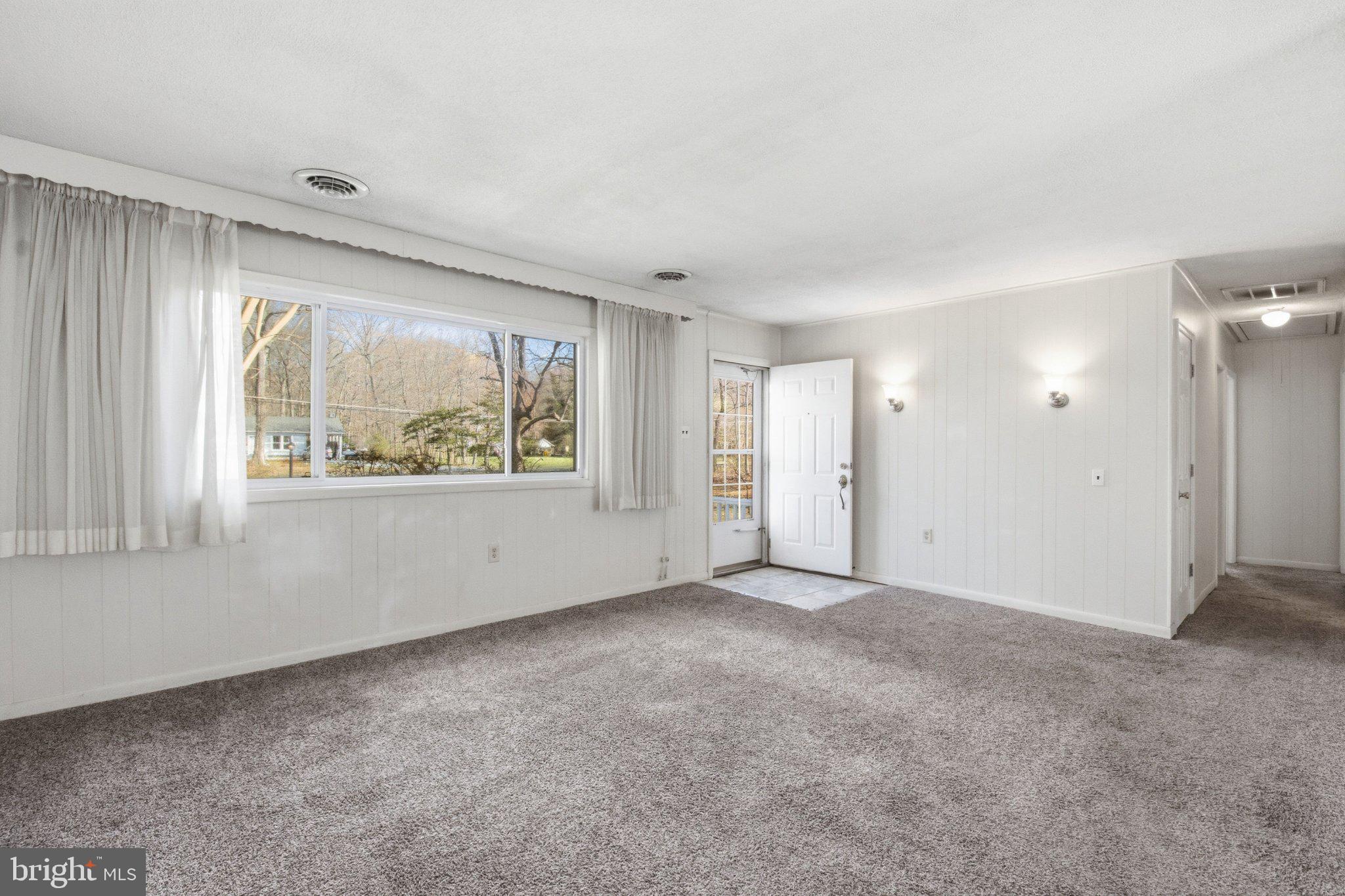 1469 Cedarhurst Road Shady Side, MD 20764 - Photo 4 of 19 a view of an empty room with a window